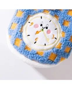 Close-up detail of soft fleece pet clothes with cute cartoon clock embroidery and warm trim.