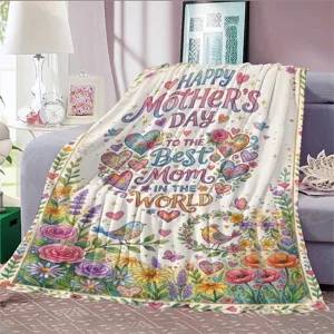 Mother's Day floral flannel blanket detail view showcasing colorful heart and bird patterns on sofa.