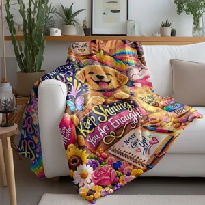 Cozy flannel blanket detail showing cute puppy, vibrant floral print and inspirational quote design.