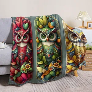 Detailed view of vintage owl and floral print flannel throw blanket for cozy home decor.