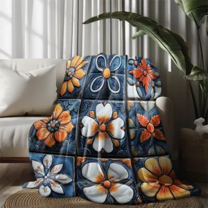Detailed view of vintage floral flannel blanket draped on sofa, soft home textile decor.