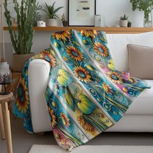 Detailed view of vintage sunflower flannel throw blanket draped on white sofa for cozy home decor.