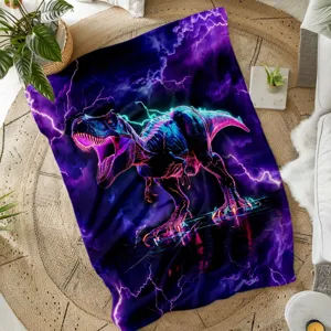 Close-up detail of the soft neon dinosaur flannel blanket with vibrant purple lightning.