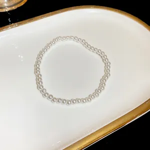Elegant white pearl bracelet for women, classic delicate wrist jewelry fashion accessory.