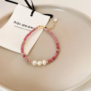 Exquisite gemstone and pearl bracelet detail shot, elegant handmade jewelry accessory.