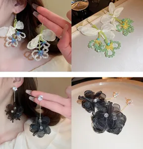Elegant crystal beaded and fabric flower earrings with sweet tassel design for women daily use.