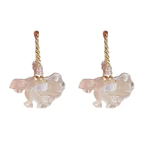 Sweet pearl petal dangle earrings with gold twisted posts and translucent flower charms main view