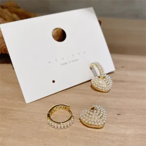 Pearl heart hoop earrings detail, vintage gold-tone jewelry, elegant Korean style accessory.