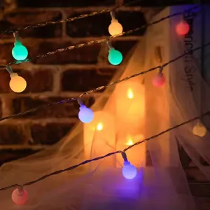 Frosted LED ball string lights for Christmas, bedroom decor, and colorful party ambiance.