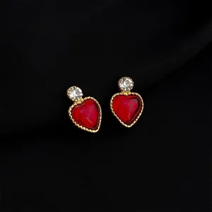 Vintage red heart clip-on earrings with gold tone border and sparkling crystal top detail.