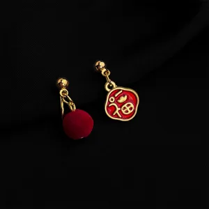 Asymmetric red pompom and fu character gold drop earrings, vintage style clip on jewelry.