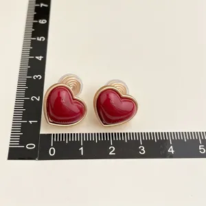 Vintage wine red heart clip earrings with gold plated finish, non piercing design, stylish jewelry.
