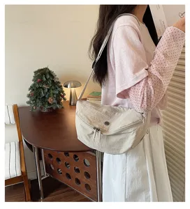 Casual nylon crescent crossbody bag for women, lightweight daily shoulder travel bag.