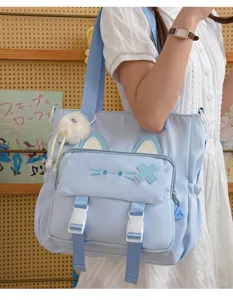 Light blue Japanese style canvas shoulder bag with cute cat ears and large capacity for students.