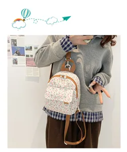 Charming small floral mini backpack with front pocket, stylish daily casual bag for women.