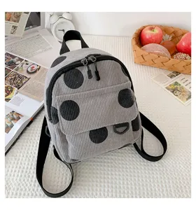 Mini corduroy backpack with black polka dots, trendy aesthetic casual daily school bag for women.