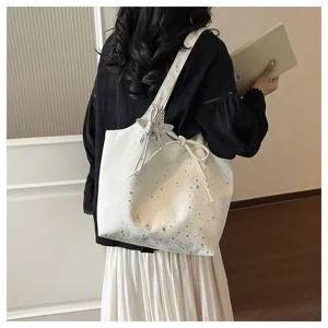 Detailed view of white star print tote bag, casual large capacity shoulder bag for women.
