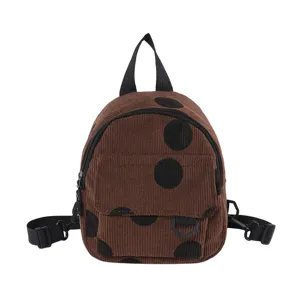 Cute brown corduroy mini backpack with black polka dots, casual vintage style daily shoulder bag.