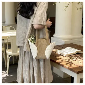 Geflochtene Stroh Handtasche mit weißem Flügeldesign, elegante lässige Schultertasche.