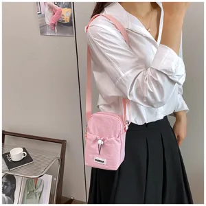 Casual women solid color phone bag, cute pink drawstring crossbody bag for travel and outdoor.