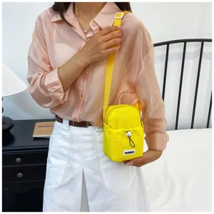 Solid color casual women's mobile phone bag with drawstring and adjustable strap for outdoor travel.