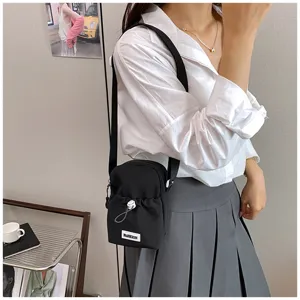 Casual black nylon crossbody phone bag with white drawstring for women travel outdoor use