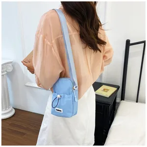 Casual solid color women crossbody phone bag with drawstring, detail view showing practical design.