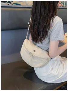 Casual solid color nylon shoulder bag for women, stylish crescent crossbody bag daily use.