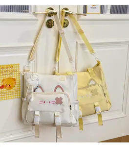 Cute Japanese style canvas shoulder bag with cute cat ears design, large capacity student bag.