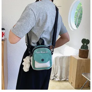 Canvas crossbody bag for women, cute small shoulder bag with letter embroidery and pendant.