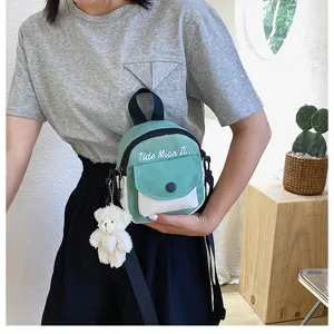 Casual canvas crossbody bag for women, cute small green shoulder bag with bear pendant.