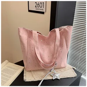 Pink star print canvas tote bag, large capacity shoulder handbag with cute star charm detail.