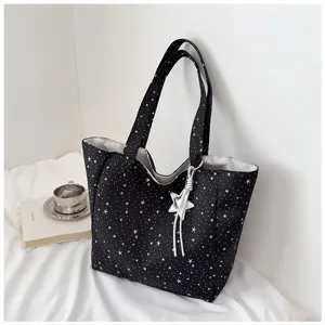 Black star print canvas tote bag, large capacity casual shoulder bag for women daily use.