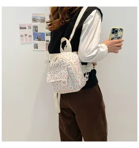 Small floral mini backpack for women, sweet fresh style student school bag lightweight daypack.