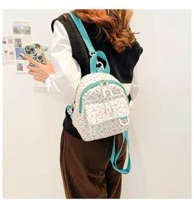 Floral print mini backpack detail showcasing sweet style, compact size and lightweight design.