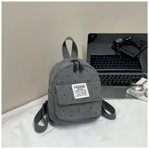 Corduroy mini backpack for women, casual small travel bag with cute floral pattern and front pocket.