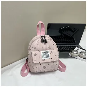 Pink corduroy mini backpack with floral print, cute casual daypack for women and kids detail view.
