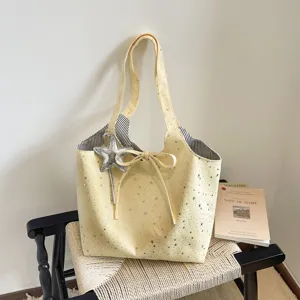 Canvas tote bag with silver star print, cute bowknot decor, and large capacity for daily commuting.