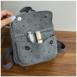 Grey corduroy mini backpack for women, cute small floral travel daypack with front pocket.