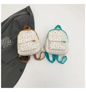 Detailed view of the sweet floral mini backpack showing front pocket and strap options.