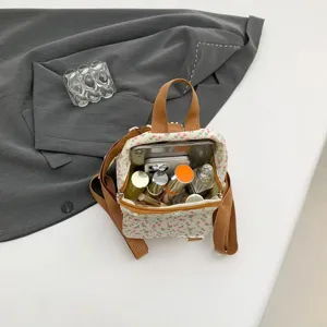 Small floral print women backpack sweet style casual daypack with spacious interior view.