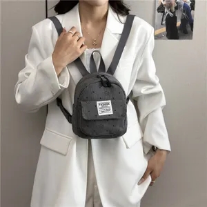 Stylish mini corduroy backpack for women, casual travel daypack with floral pattern.