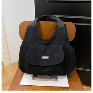 Detailed black corduroy tote bag, large capacity shoulder bag for daily commute, student use.