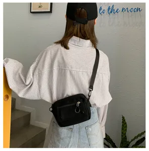 Borsa a tracolla casual in tela nera da donna, elegante borsetta da studente per uso quotidiano.