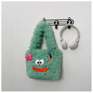 Green fluffy plush tote bag featuring cute cartoon face design, soft furry shoulder handbag.