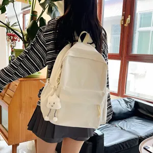 Simple white canvas backpack with cute cloud pendant for school girls and daily casual use.