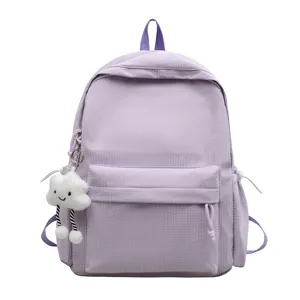 Light purple grid backpack for students with cute cloud pendant, stylish and spacious daily bag.