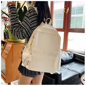 Minimalist canvas school backpack for students with cute cloud pendant, casual daily daypack.