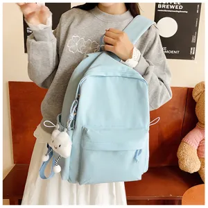 Light blue canvas school backpack for students, casual daily casual daypack with cute pendant.