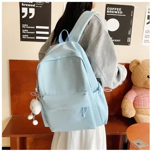 Light blue small plaid backpack for students, simple literary style school bag for daily use.